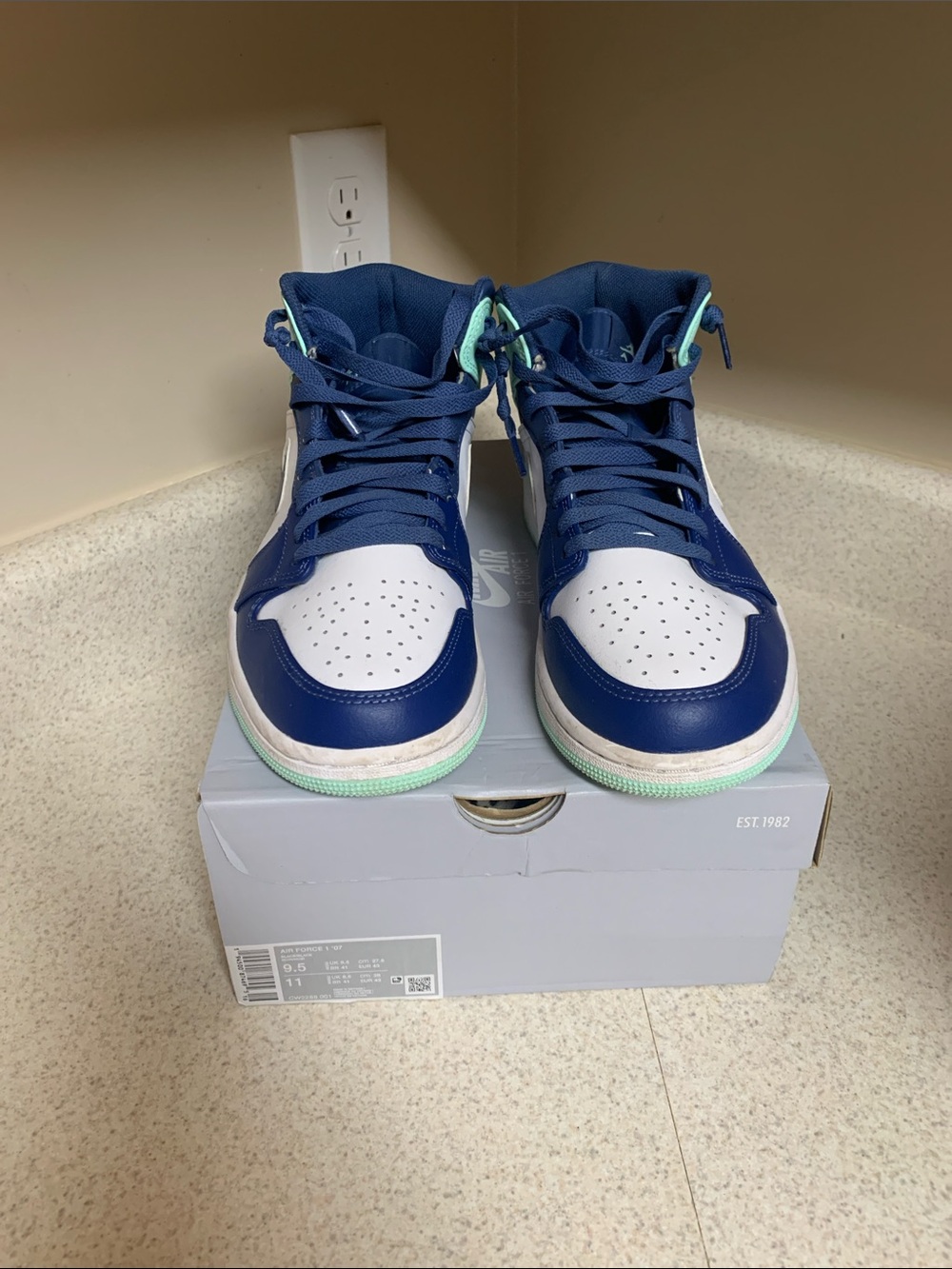 Jordan Navy and White High-Top Sneakers with Mint Sole Trim